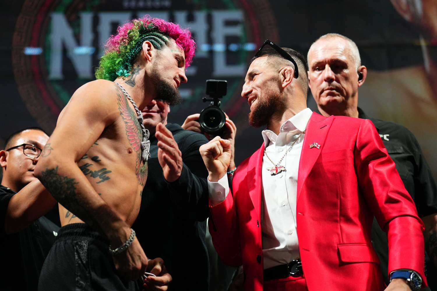 Sean O'Malley (left) and his opponent in UFC 306 Merab Dvalishvili stare each other down at a press conference.