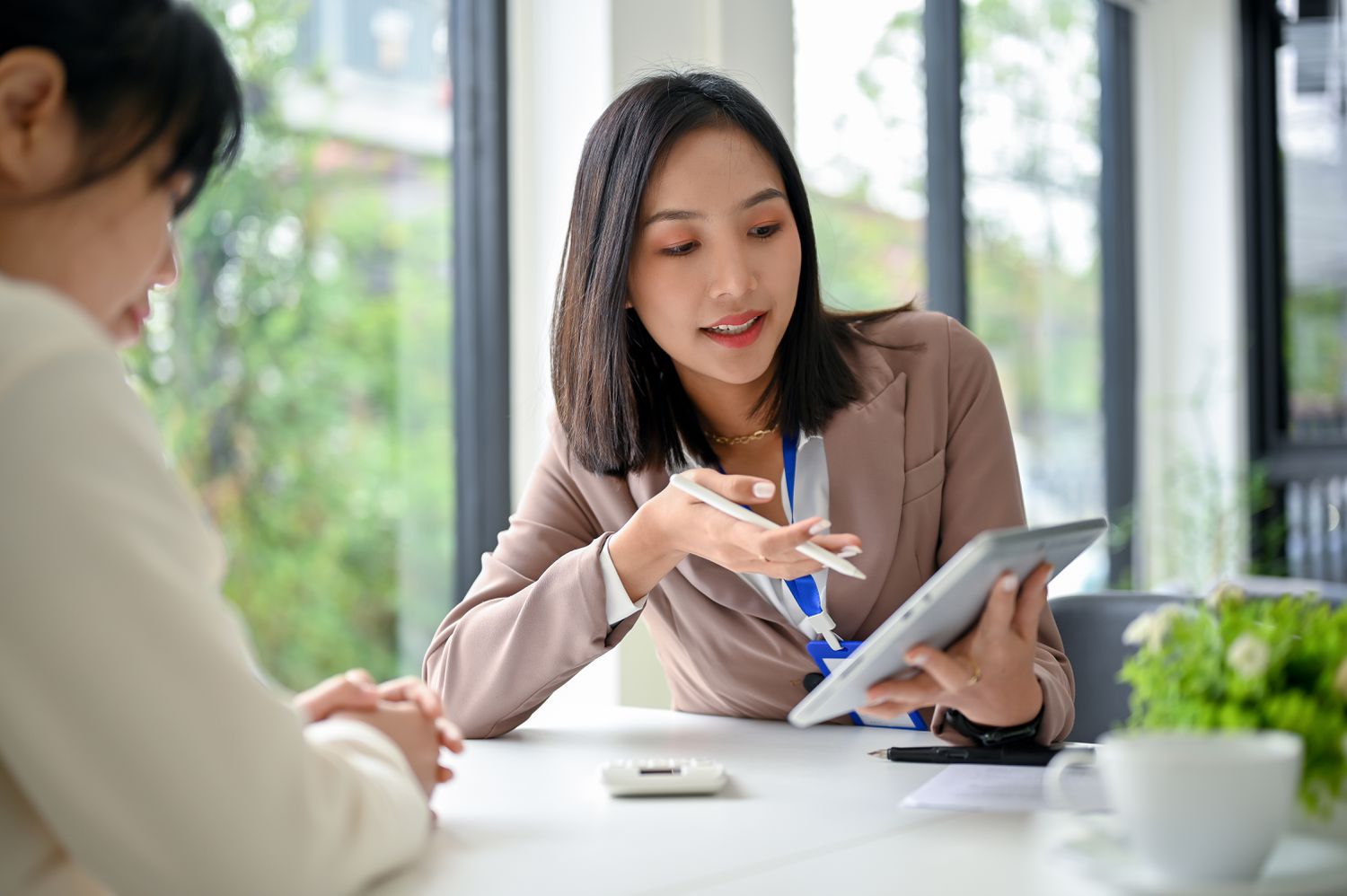 Lender goes over personal loan contract with client.