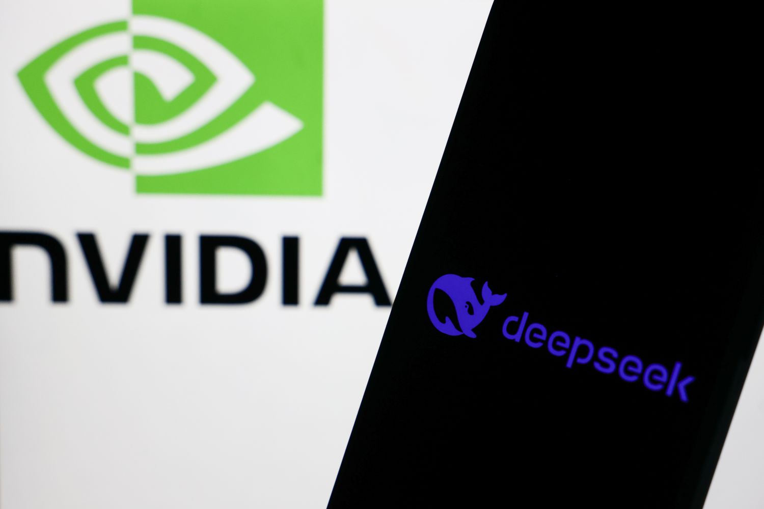 Nvidia logo on a laptop screen and DeepSeek logo on a phone screen