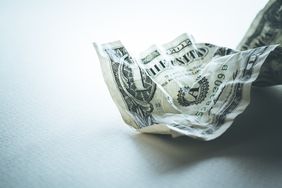 A crumpled up dollar bill
