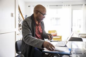 Man planning his retirement trying to figure out how much taxes are on an IRA withdrawal. 