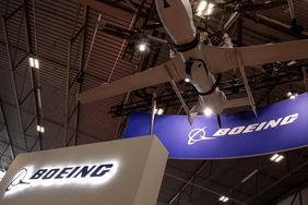 The Boeing logo is seen inside a conference center.