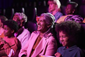 A group of people watching a movie