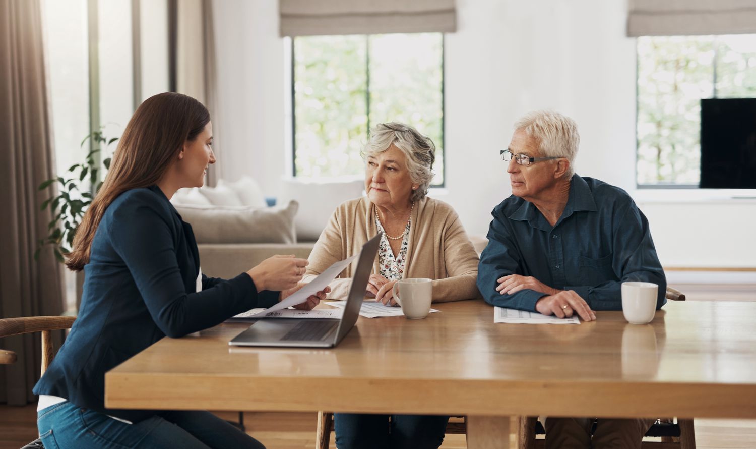 An estate planner works with an older adult couple to explain some of the taxes heirs could face as beneficiaries.