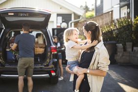 A family packs a car.
