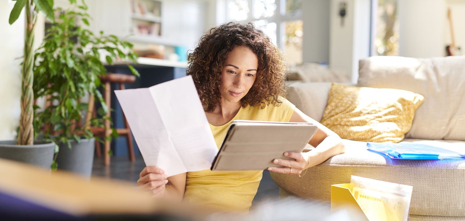 A woman reviewing documents.