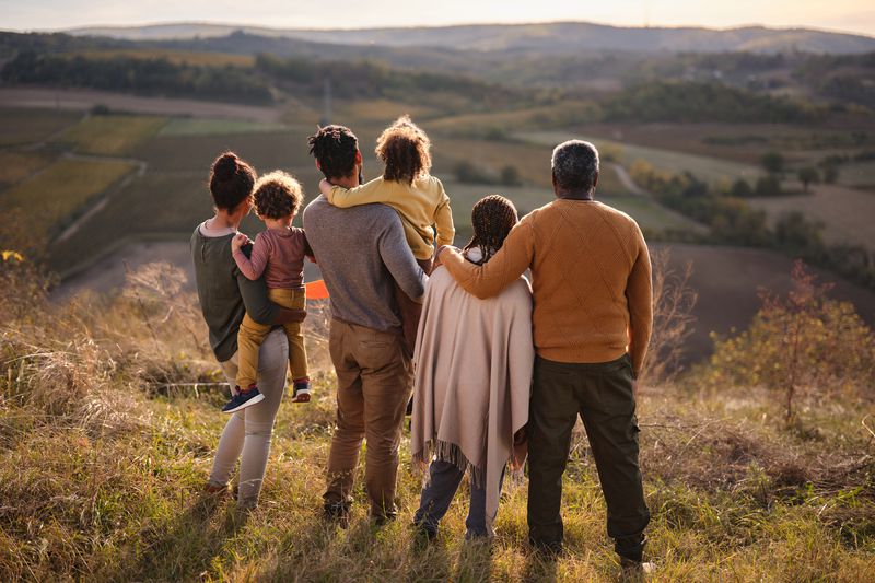 Family looking out onto a hill