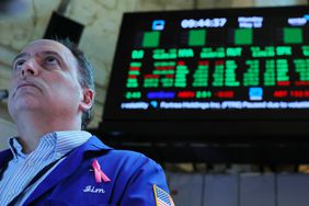 Traders work on the floor of the New York Stock Exchange.