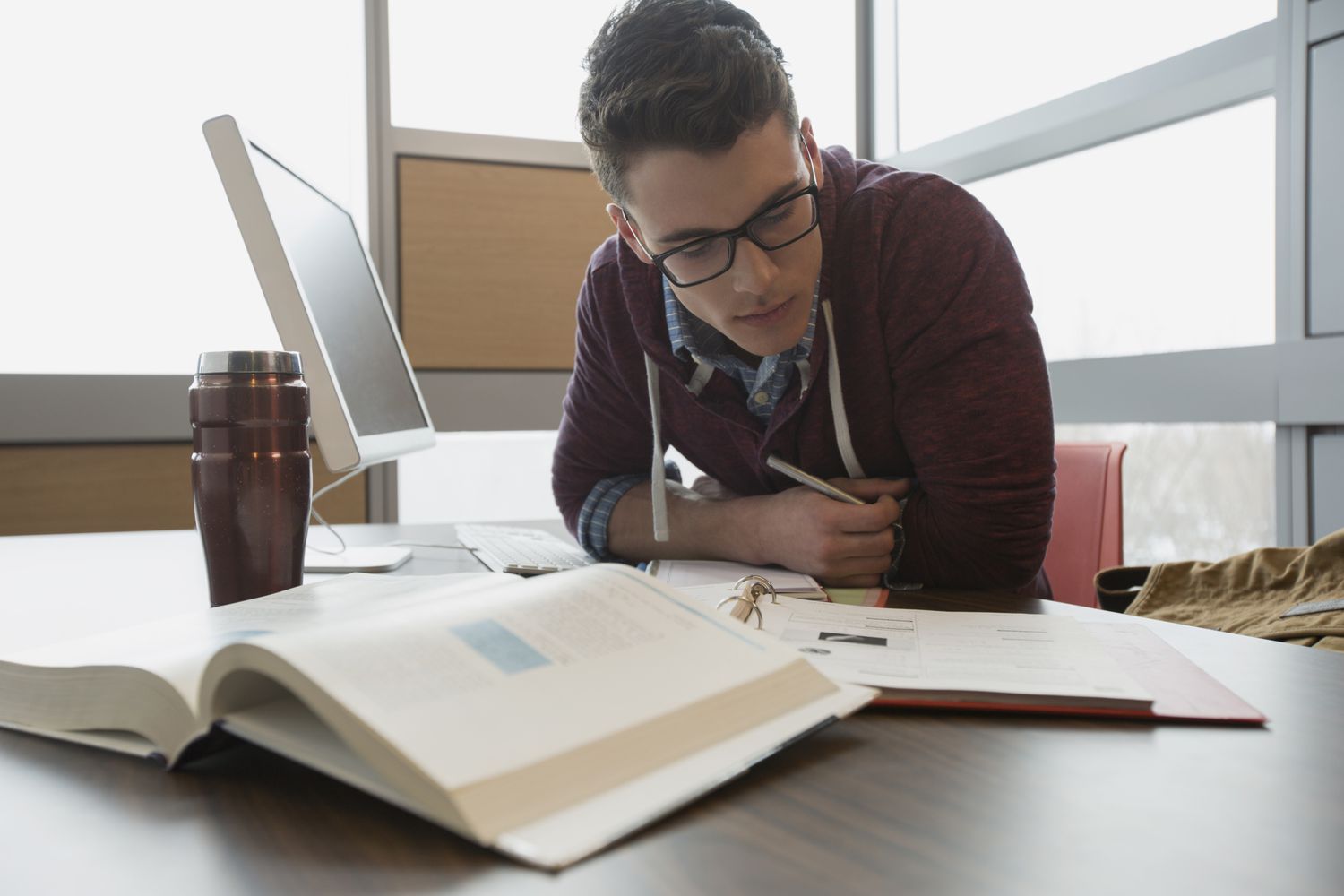 College student studying at computer