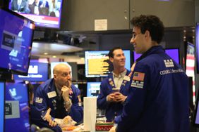Traders work on the floor of the New York Stock Exchange