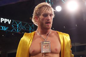 Logan Paul with a Pokemon card around his neck in 2021. 