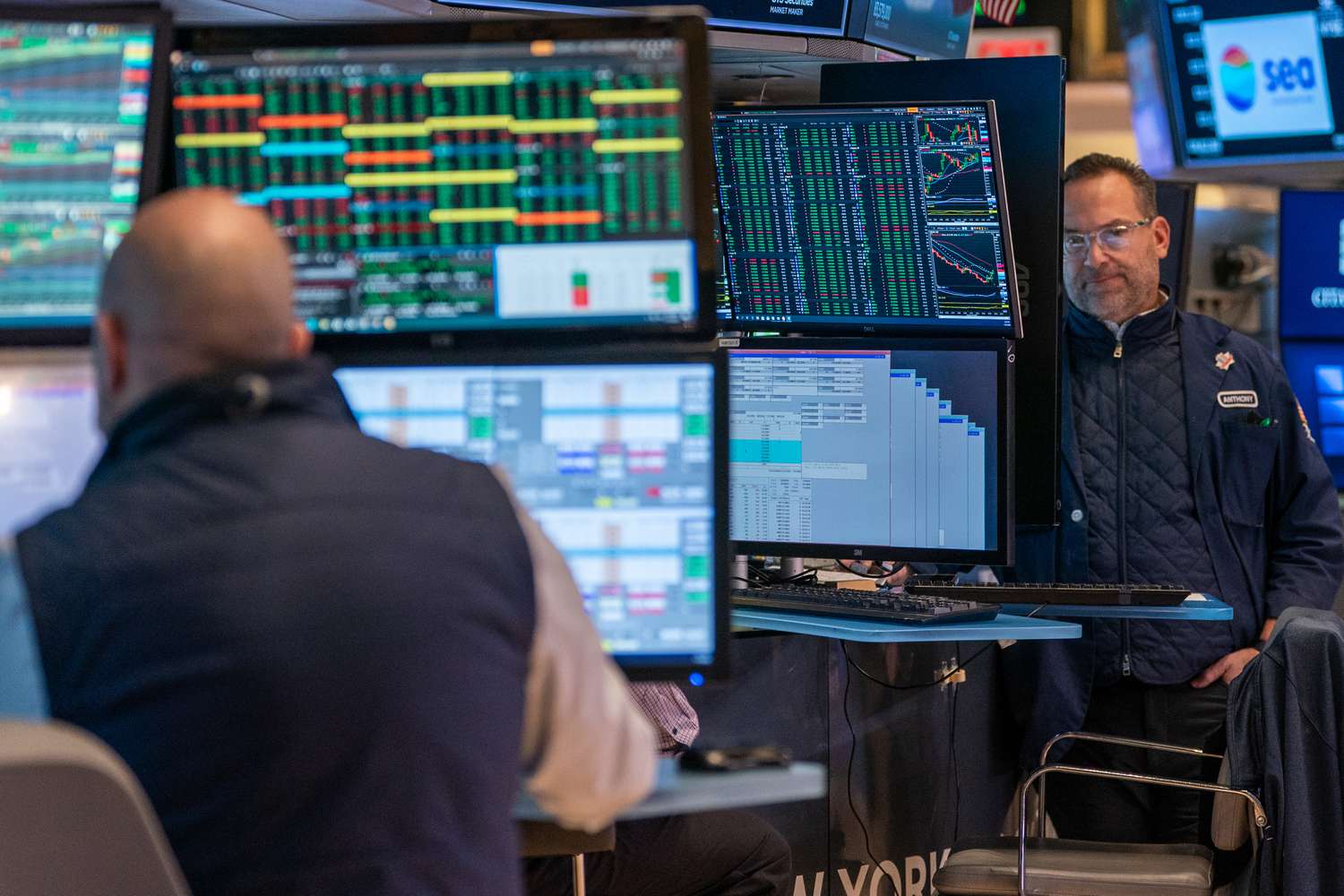 Traders work on the floor of the New York Stock Exchange