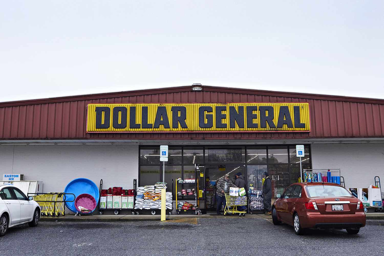 A costumer leaves Dollar General. 