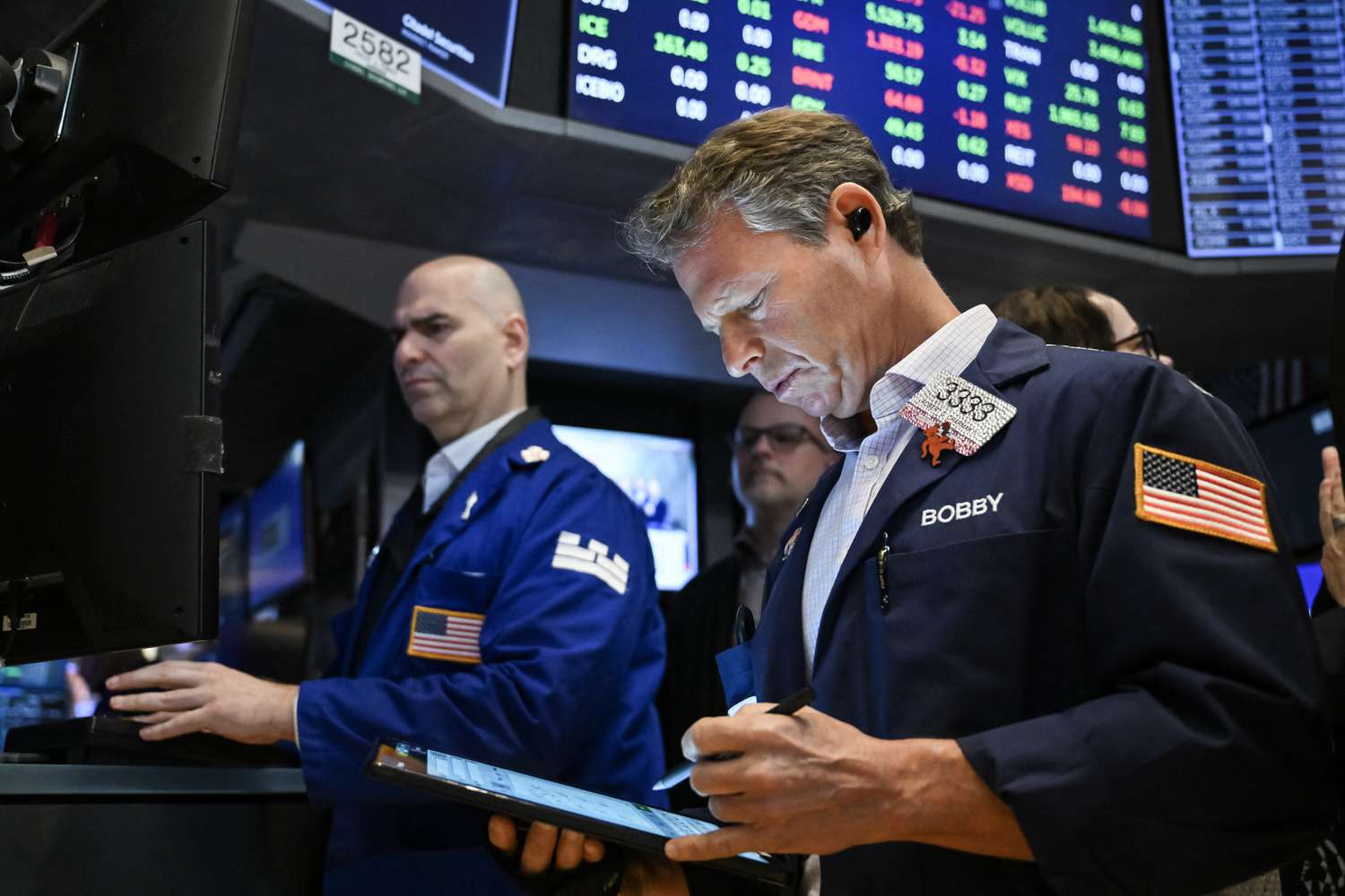 Traders work on the floor of the New York Stock Exchange 