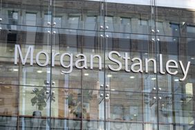 The gray Morgan Stanley logo is seen on the side of a glass office building.
