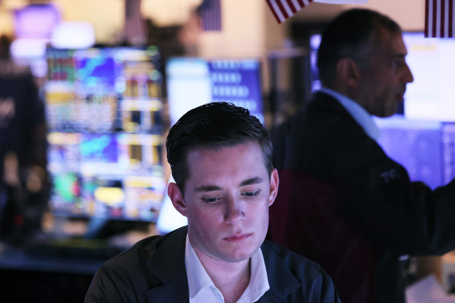 Traders work on the floor of the New York Stock Exchange.