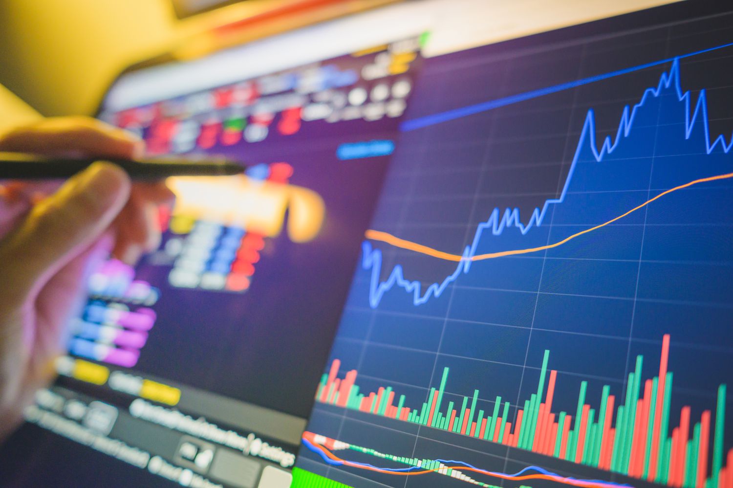 A stock trader watching a thrusting line showing increasing demand for a particular stock.