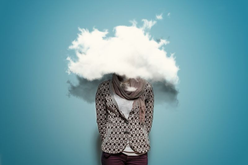 A woman with her head in the clouds, literally.