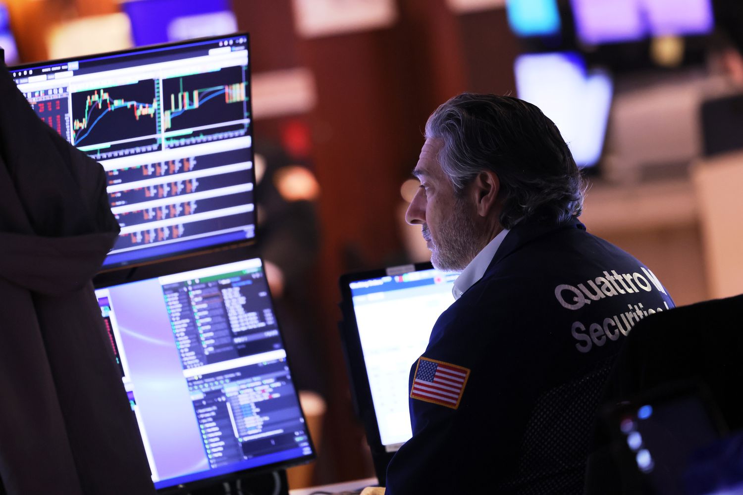 Traders work on the floor of the New York Stock Exchange