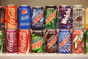 lines of cans from pepsi and coca cola