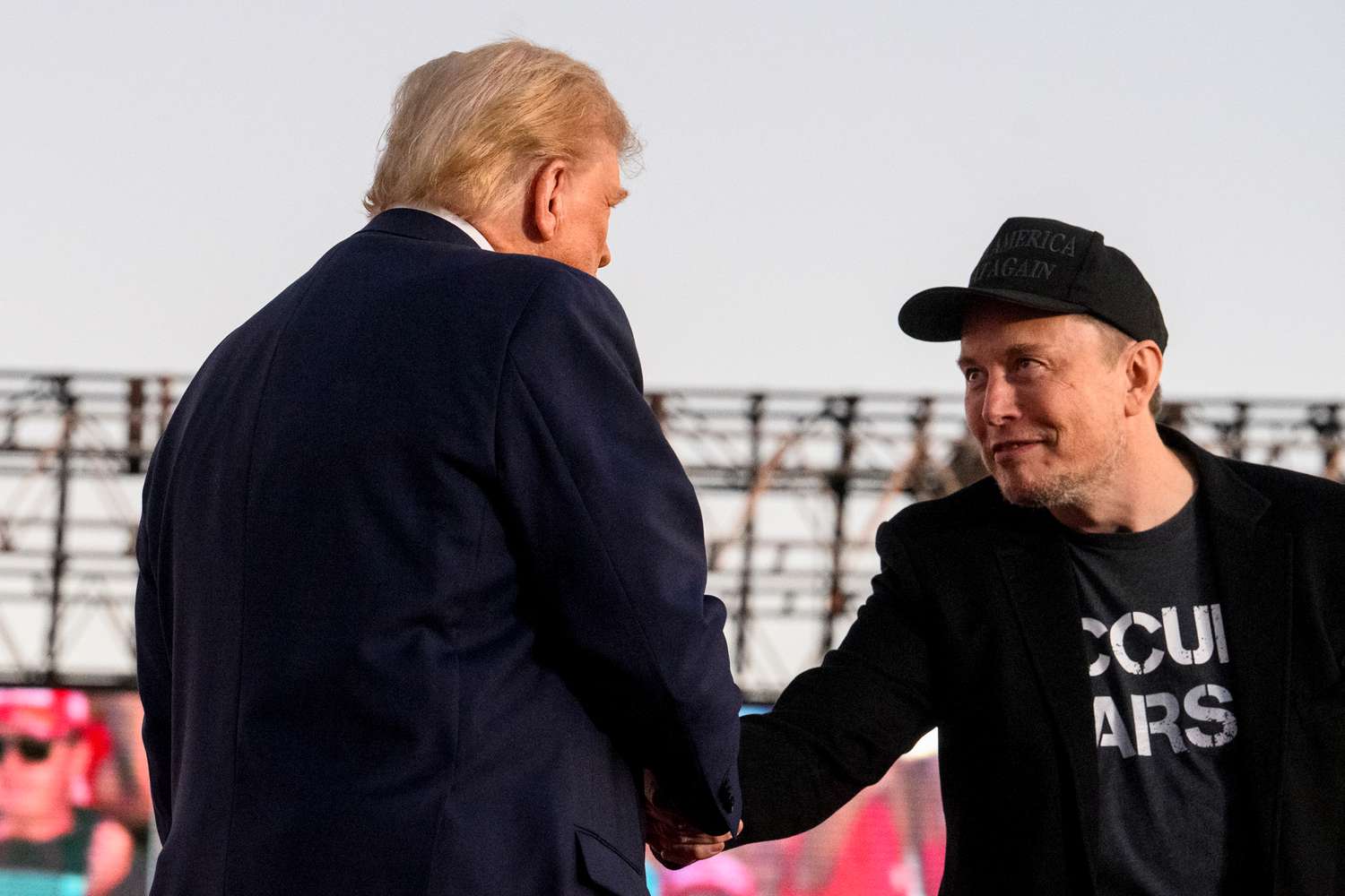 Elon Musk, chief executive officer of Tesla Inc., right, and former US President Donald Trump during a campaign event at the Butler Farm Show in Butler, Pennsylvania, US, on Saturday, Oct. 5, 2024.