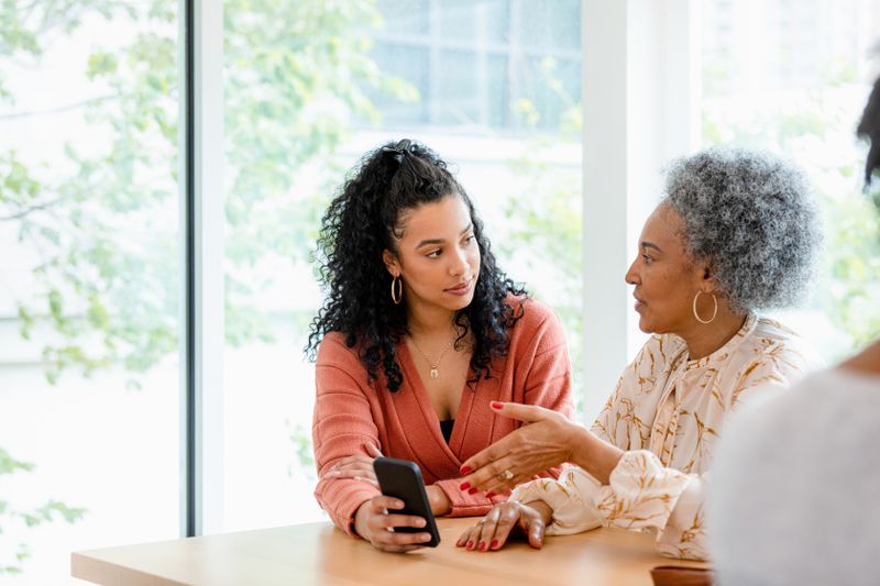 Woman asking a consultant about a prepaid tuition plan