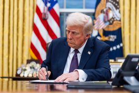 President Donald Trump signs executive orders in the Oval Office of the White House in Washington, DC, US, on Monday, Jan. 20, 2025.