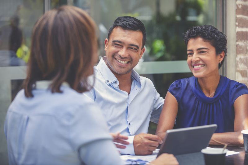 Couple meeting with financial coach