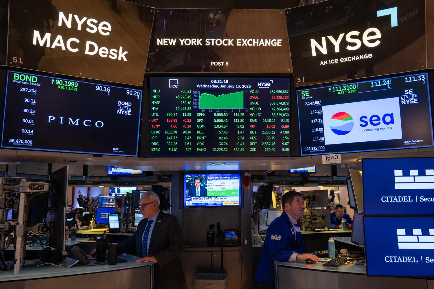Traders work on the floor of the New York Stock Exchange (NYSE) 