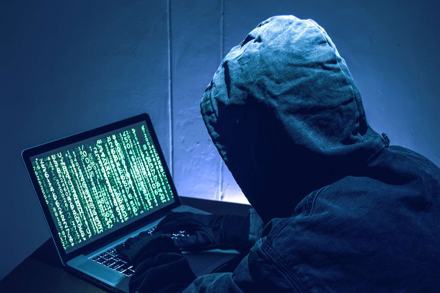 A depiction of a hacker stealing passwords.