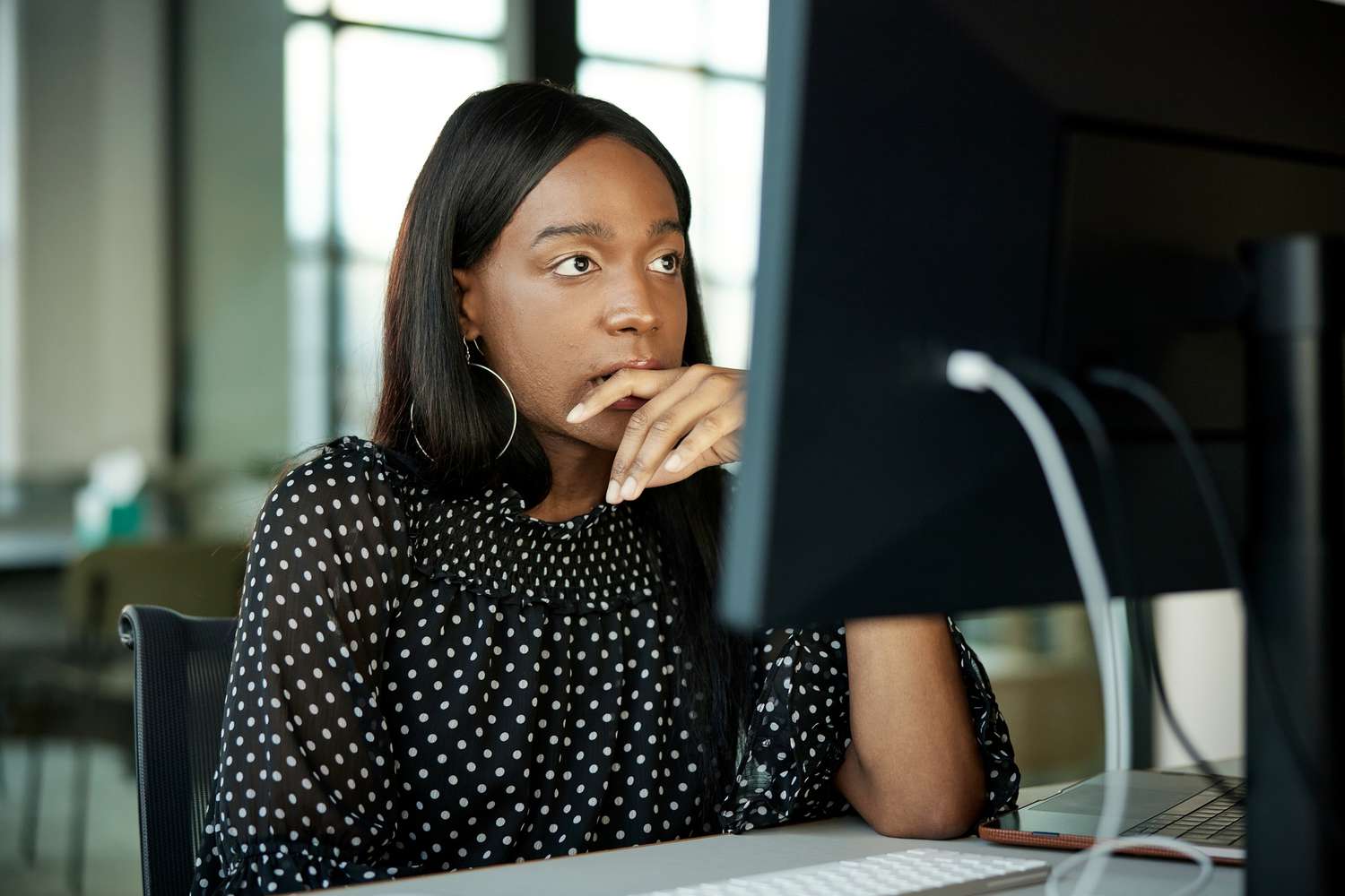 Woman reading about the difference between real estate taxes vs. property taxes