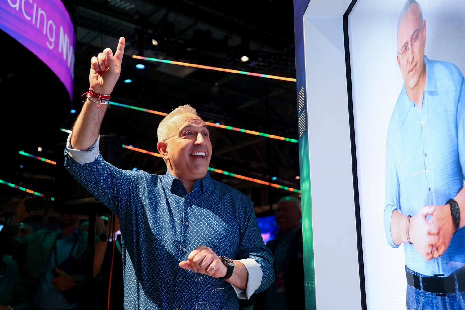 Antonio Neri, chief executive officer of Hewlett Packard Enterprise Co. (HPE), reacts after an AI avatar answers a question during a showroom floor tour at the HPE Discover event at the Sphere in Las Vegas, Nevada, US, on Tuesday, June 18, 2024. 
