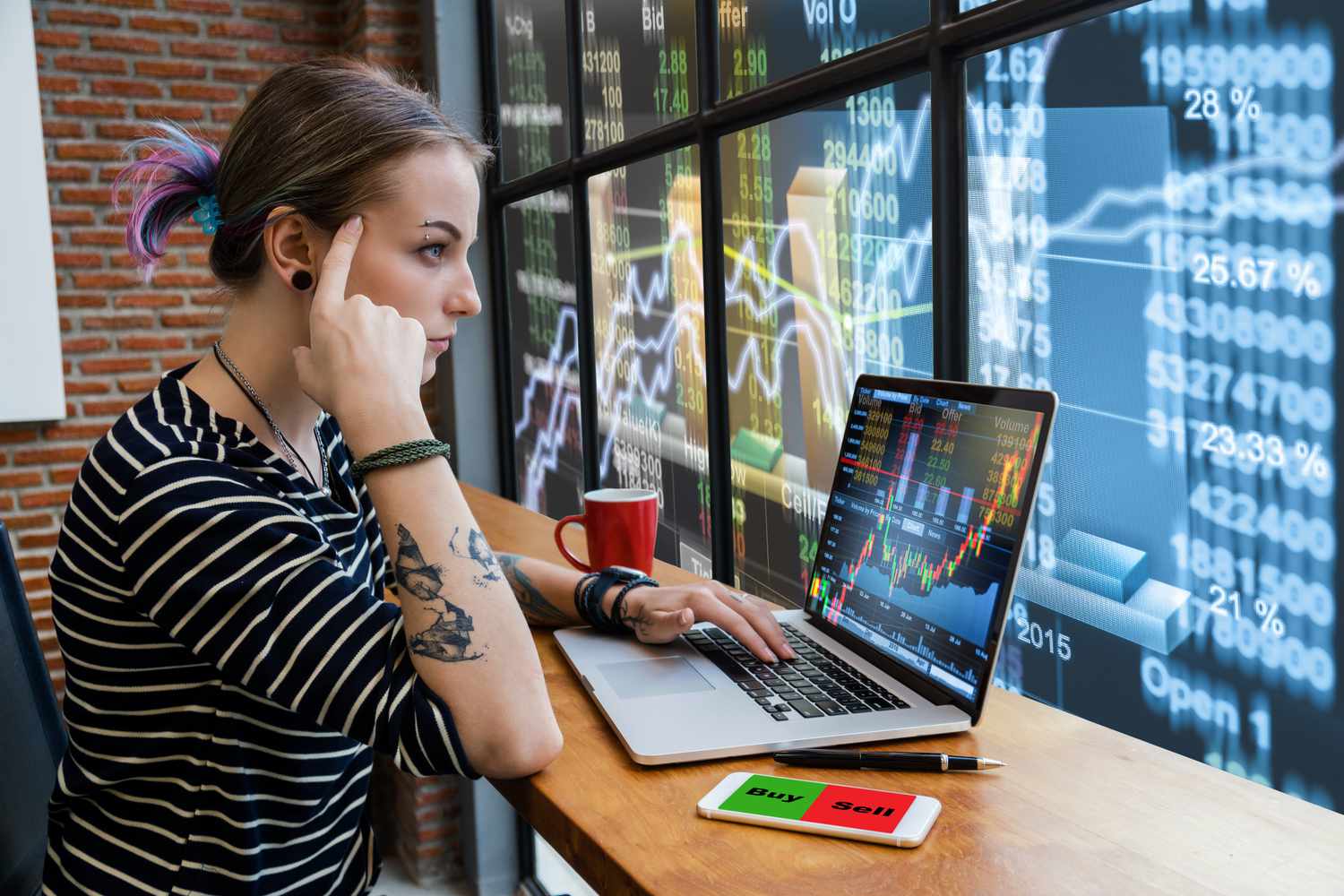 Business financial and forex concept, Hipster young Woman freelancer thinking about her job and using computer laptop showing trading graph with the stock exchange trading graph screen background