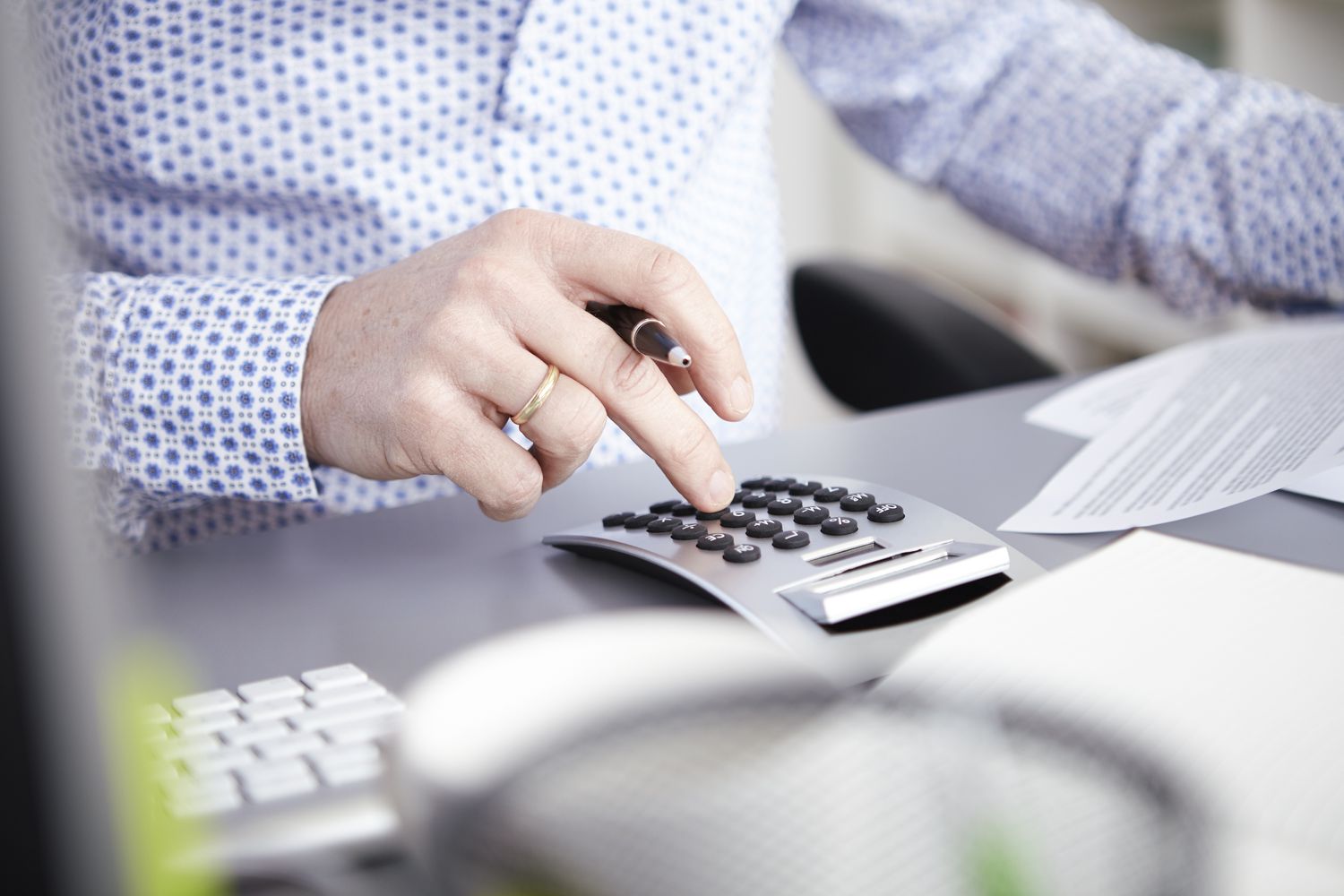 Businessman using calculator