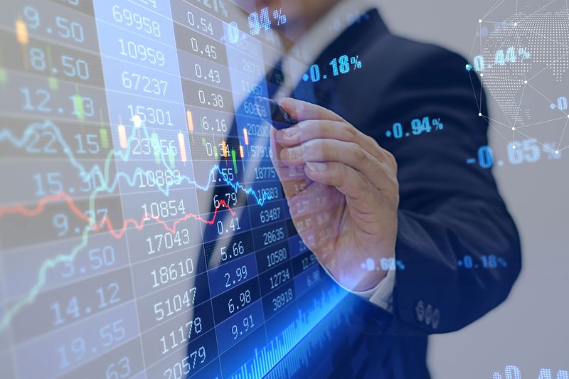 Businessman Touching Futures Data With Pen
