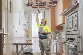 Repair worker inspects the home of a single-purpose reverse mortgage