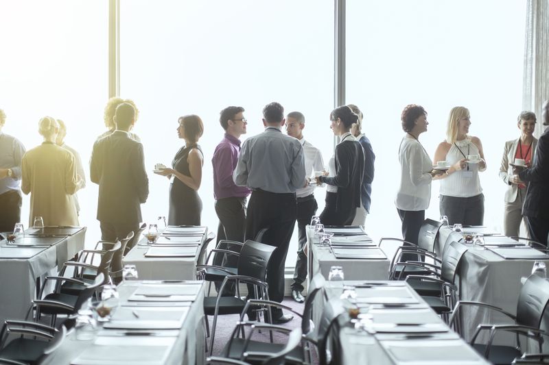 Group of professional people talking in a conference room.